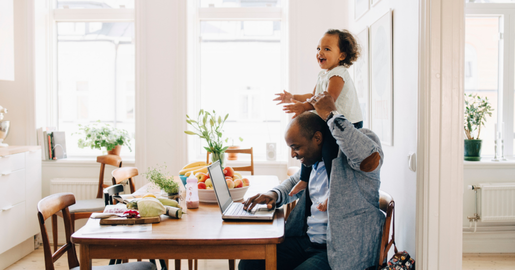 Dad working from home with daughter