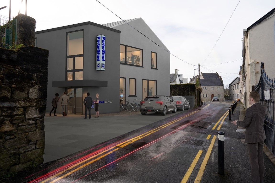 Multiple people and cars outside the new Portershed extension